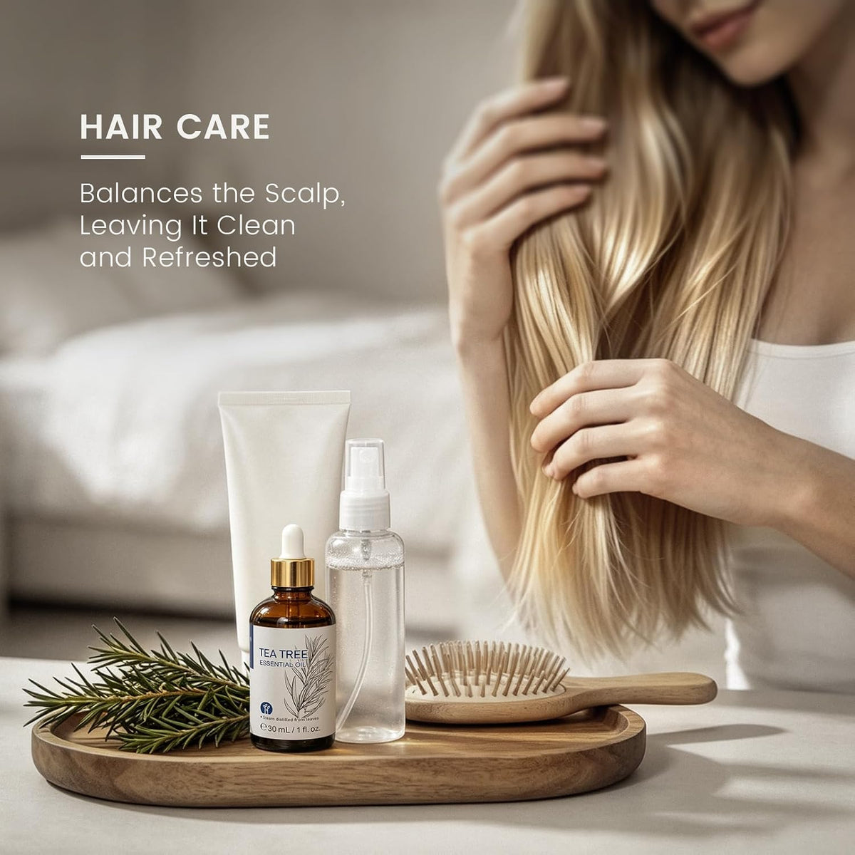 Woman brushing her hair beside a tea tree essential oil bottle