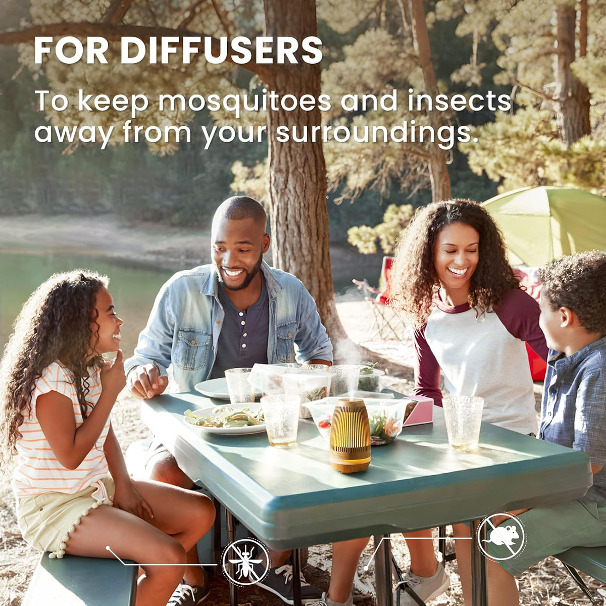 Family at an outdoor table beside a diffuser using HIQILI Peppermint Essential Oil to keep insects away
