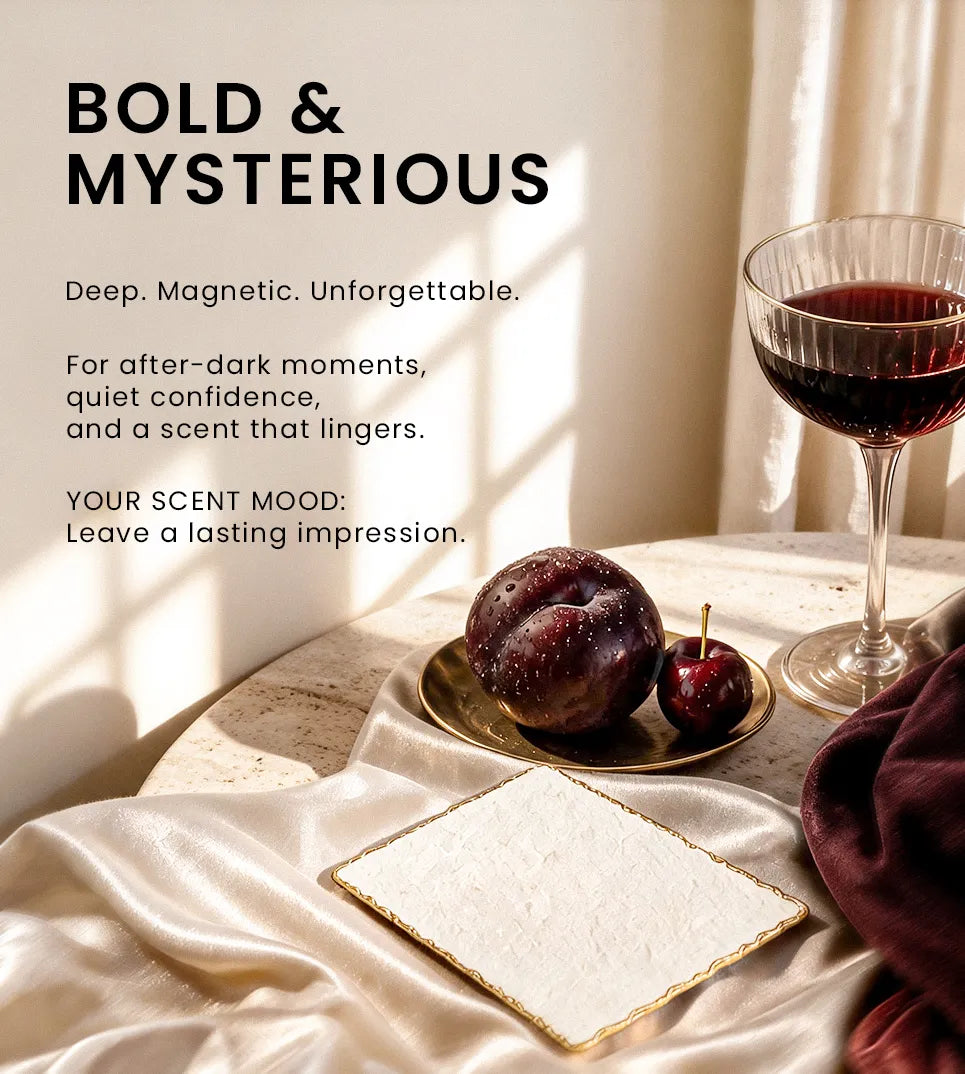 Bold and mysterious fragrance mood featuring dark plums, red wine, silk fabric, and a luxurious evening scent atmosphere