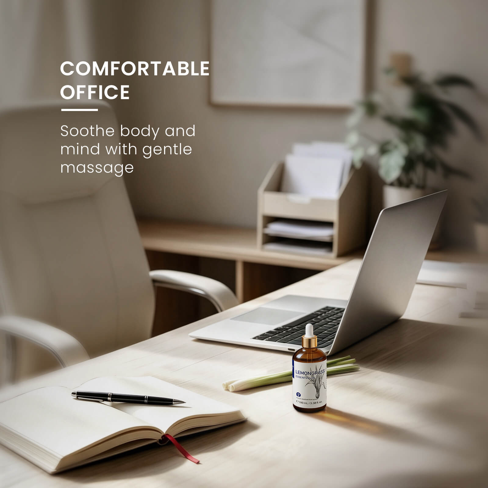 HIQILI Lemongrass Essential Oil on an office desk beside a laptop, notebook, and fresh lemongrass.