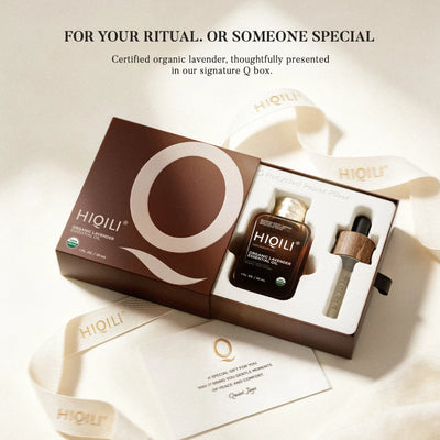 HIQILI organic lavender essential oil and glass dropper in an open signature Q gift box, with branded ribbon and a gift card.