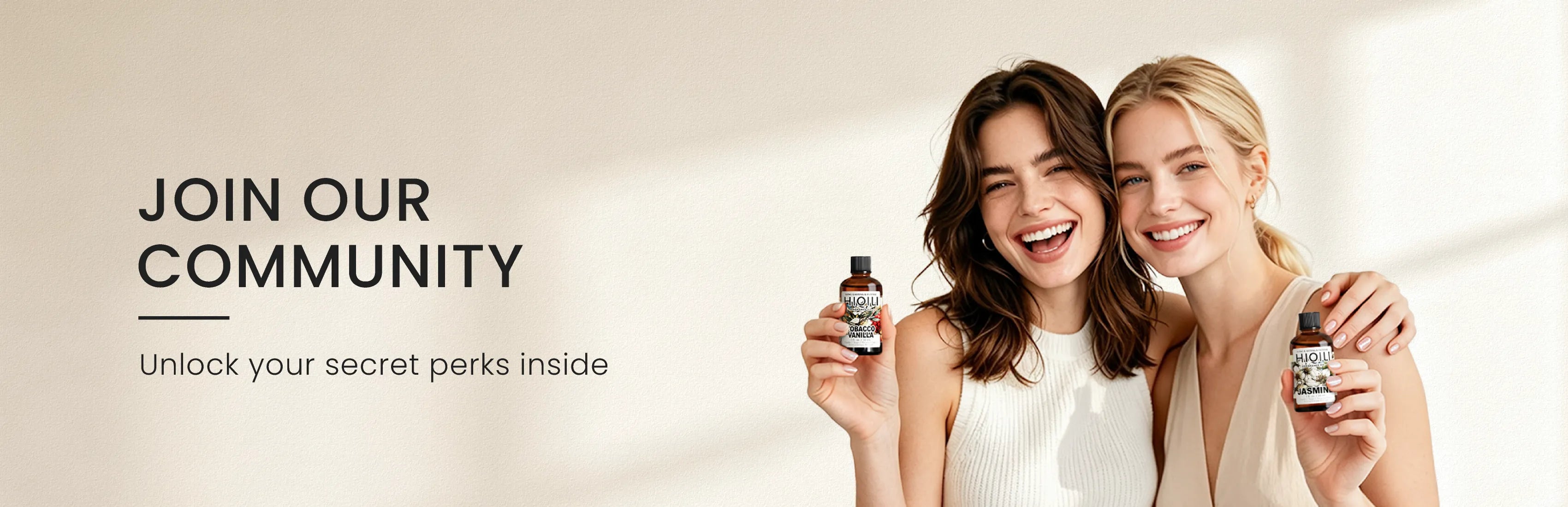Two women holding HIQILI fragrance oils while promoting exclusive benefits for the HIQILI community.