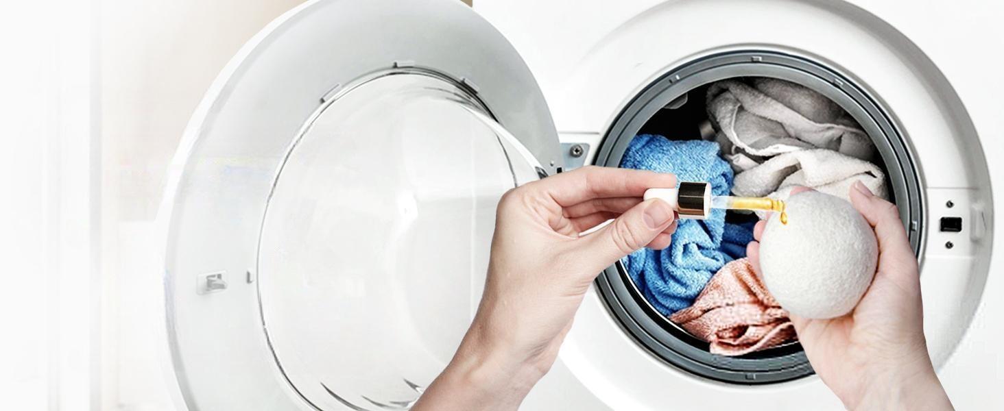 Woman adding pure vanilla essential oil to wool dryer balls for natural, chemical-free scented laundry and soft clothes.